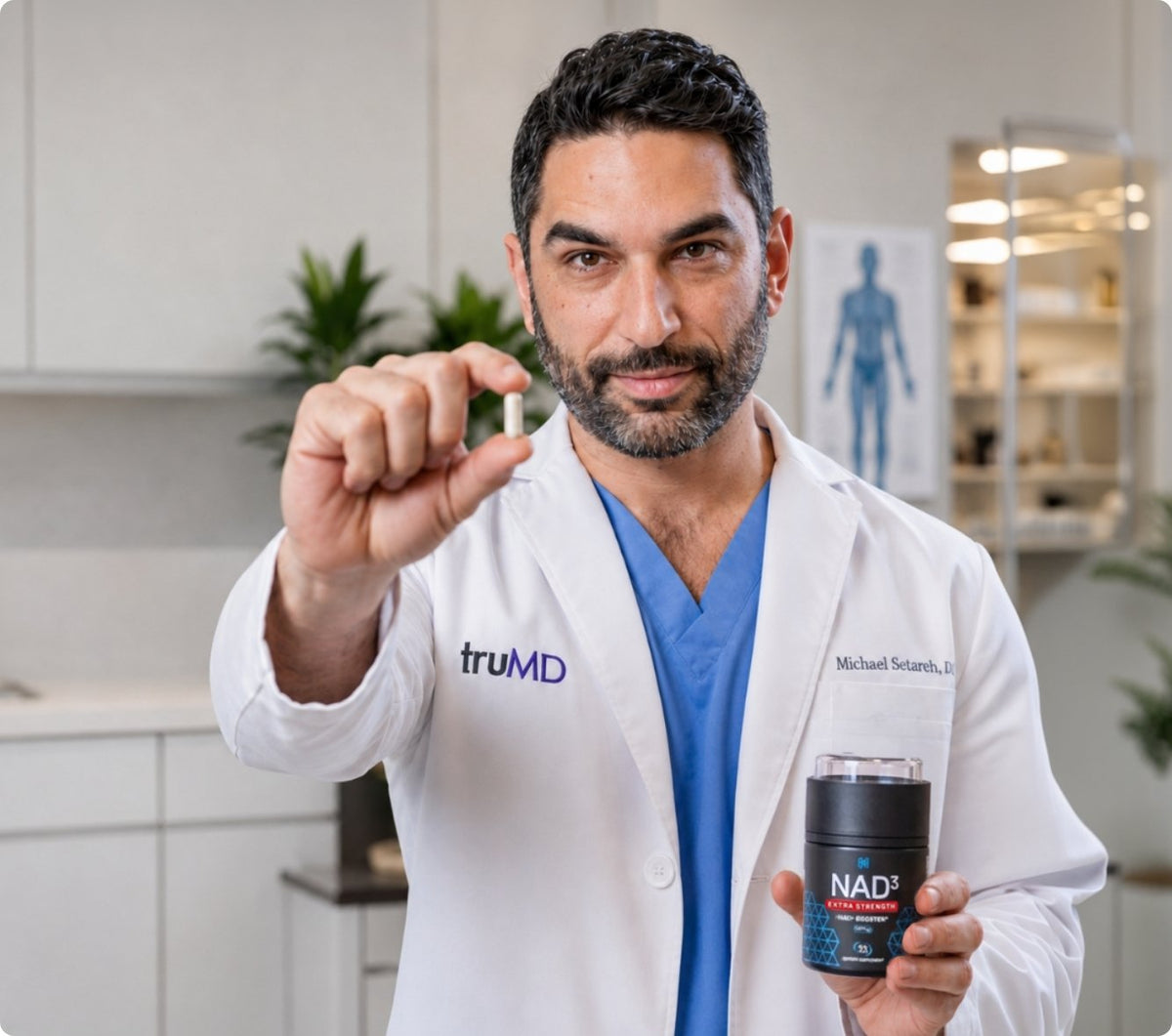 Dr. Michael Setareh holding a NAD3 Extra Strength capsule